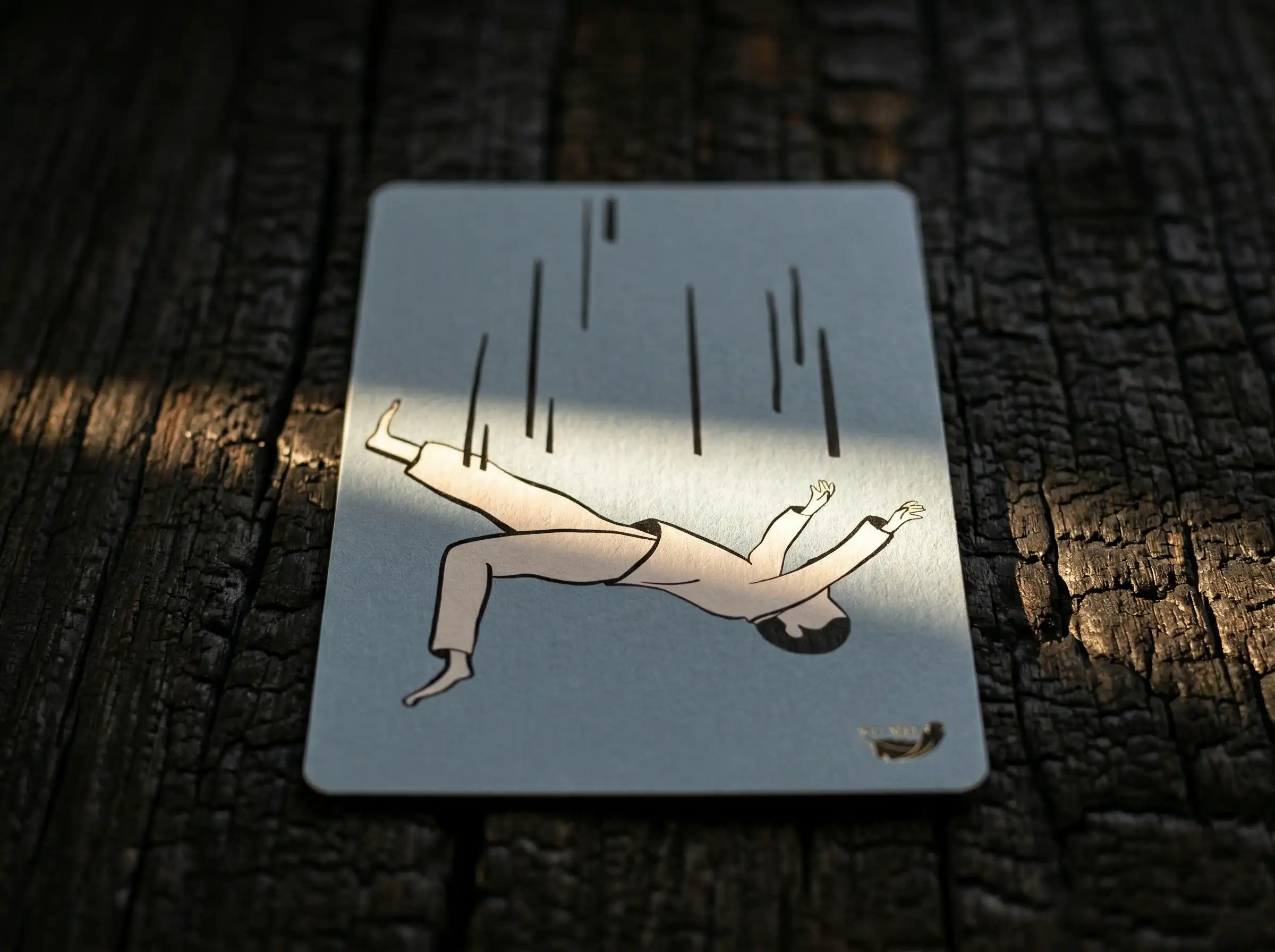 Wu Wei Cards product showing a card with an illustration of person falling